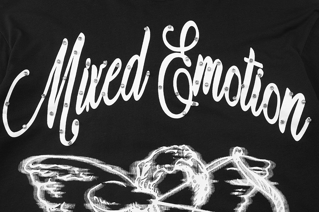 MIXED EMOTION Winged Skull Graphic Long Sleeve Top