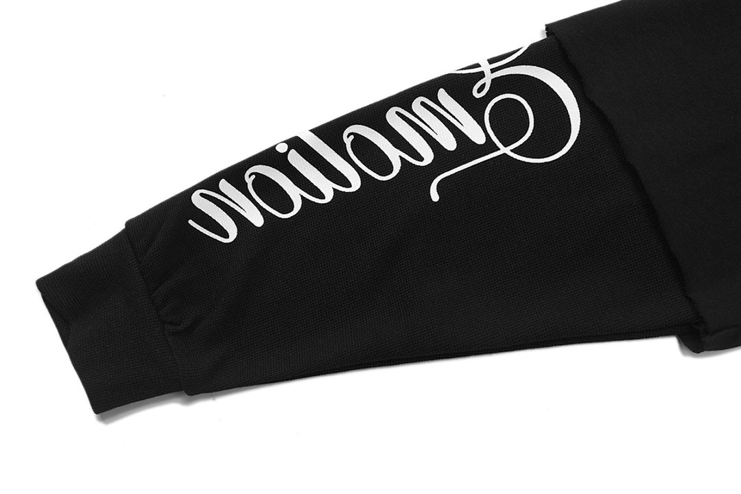 MIXED EMOTION Winged Skull Graphic Long Sleeve Top