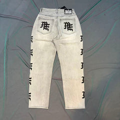 MIXED EMOTION Washed Side Graphic Denim Jeans