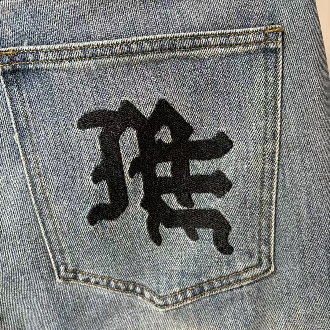 MIXED EMOTION Repeated Letter Side Graphic Jeans